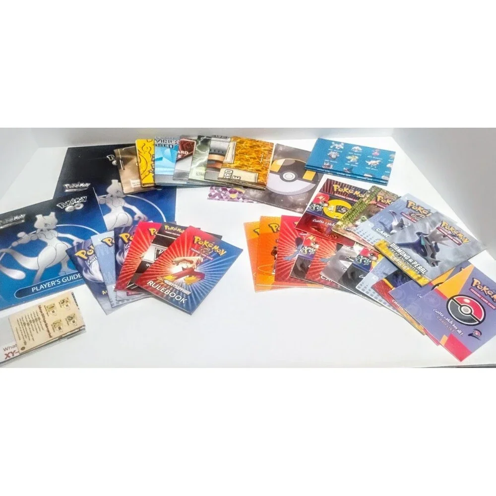MASSIVE GAME FREAK POKEMON TCG CARD LIST RULEBOOK & PLAYMAT LOT W MORE